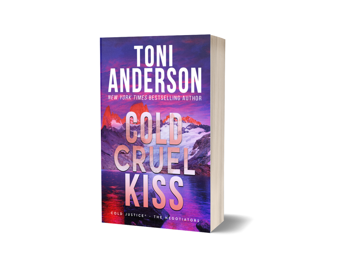 A 3D mockup of the paperback book 'Cold Cruel Kiss' by Toni Anderson, featuring a vibrant purple and pink mountain landscape cover, set against a plain white background with a soft shadow.
