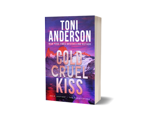 A 3D mockup of the paperback book 'Cold Cruel Kiss' by Toni Anderson, featuring a vibrant purple and pink mountain landscape cover, set against a plain white background with a soft shadow.